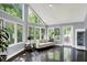 Living room with large windows offering lots of natural light, a plush couch, and a modern aesthetic at 8924 Stormhaven Ct, Indianapolis, IN 46256