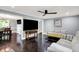 Comfortable living room with a large television and lots of seating at 8924 Stormhaven Ct, Indianapolis, IN 46256