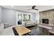 Cozy living room featuring a stone fireplace and comfortable seating at 8924 Stormhaven Ct, Indianapolis, IN 46256