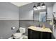 Stylish powder room with elegant fixtures, patterned floors, and modern lighting at 8924 Stormhaven Ct, Indianapolis, IN 46256