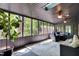 Relaxing sunroom with natural light, ceiling fans, comfortable seating, and picturesque views at 8924 Stormhaven Ct, Indianapolis, IN 46256