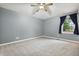 Comfortable bedroom with neutral walls, carpet flooring, and a window providing natural light and outdoor views at 9189 Dawn Dr, Brownsburg, IN 46112