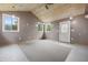 Versatile bonus room with wood ceiling, ample natural light, and direct access to the outdoors at 9189 Dawn Dr, Brownsburg, IN 46112
