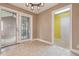 Open dining area with tile floors, stylish light fixture, and sliding glass doors to the backyard at 9189 Dawn Dr, Brownsburg, IN 46112