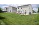 Expansive backyard with a patio, grill, and play set, ready for Gathering fun at 9215 Stones Bluff Pl, Indianapolis, IN 46113