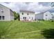Spacious backyard perfect for outdoor entertaining, featuring a patio and play set at 9215 Stones Bluff Pl, Indianapolis, IN 46113