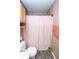 Practical bathroom with a shower, toilet, and vanity with a light wood cabinet at 9215 Stones Bluff Pl, Indianapolis, IN 46113