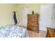 Comfortable bedroom featuring a wooden dresser for storage and a closet at 9215 Stones Bluff Pl, Indianapolis, IN 46113