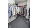 Spacious walk-in closet with clothing racks and overhead storage at 9215 Stones Bluff Pl, Indianapolis, IN 46113