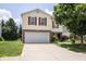 Charming two-story home featuring a brick-accented front and attached two car garage at 9215 Stones Bluff Pl, Indianapolis, IN 46113