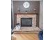 A stone fireplace with a mantle is highlighted in the living room at 9215 Stones Bluff Pl, Indianapolis, IN 46113