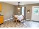 Cozy eat-in kitchen with a view of the backyard and a dining table, bathed in soft natural light at 9215 Stones Bluff Pl, Indianapolis, IN 46113