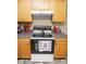 Kitchen has a range and grey counters with lots of cabinets at 9215 Stones Bluff Pl, Indianapolis, IN 46113