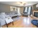 Spacious living room with a comfortable couch, fireplace and view of the eat-in kitchen at 9215 Stones Bluff Pl, Indianapolis, IN 46113
