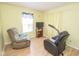 Relaxing living room featuring comfortable recliners and natural light from the window at 9215 Stones Bluff Pl, Indianapolis, IN 46113