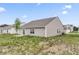View of the back exterior of the house, showing the patio and backyard space at 10107 Camp Creek Way, Indianapolis, IN 46229