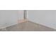 A neutral toned bedroom featuring carpeted floors, white walls and trim, and a view into the hallway at 10107 Camp Creek Way, Indianapolis, IN 46229