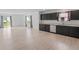 Open floor plan featuring a kitchen with black cabinetry, stainless steel appliances, and a spacious living area at 10107 Camp Creek Way, Indianapolis, IN 46229