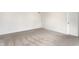 A bedroom with white walls, carpet, and a view of the doors at 10210 Samerton Ln, Indianapolis, IN 46239