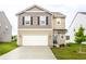 Charming two-story home featuring a two-car garage and a well-maintained front yard at 10210 Samerton Ln, Indianapolis, IN 46239