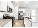 Well-equipped kitchen with stainless steel appliances, ample countertop space, and stylish fixtures at 10210 Samerton Ln, Indianapolis, IN 46239