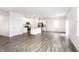 Bright, open-concept living space connects the kitchen and living areas with stylish flooring at 10210 Samerton Ln, Indianapolis, IN 46239