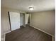 Bedroom with neutral walls, wood-look flooring, ceiling light, and closet at 10316 Woodhaven Cir, Indianapolis, IN 46229