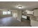 Open-concept living room and kitchen boasts new laminate floors and neutral paint palette at 10316 Woodhaven Cir, Indianapolis, IN 46229