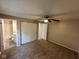 Bedroom featuring neutral walls, carpet, ceiling fan and an ensuite bathroom at 10316 Woodhaven Cir, Indianapolis, IN 46229