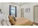This bedroom features wood floors, neutral walls and curtains, and recessed lighting at 1046 N Hamilton Ave, Indianapolis, IN 46201