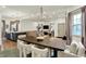 Open-concept dining and living area with modern lighting, hardwood floors, and neutral decor at 1046 N Hamilton Ave, Indianapolis, IN 46201