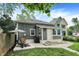 Exterior view of a home with a patio and well-kept yard at 1046 N Hamilton Ave, Indianapolis, IN 46201