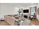 Cozy living room with hardwood floors, fireplace, and comfortable seating arrangements at 1046 N Hamilton Ave, Indianapolis, IN 46201