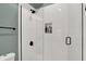 This newly remodeled bathroom features a seamless shower and white subway tile at 1046 N Hamilton Ave, Indianapolis, IN 46201