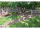 Serene backyard featuring a hammock and landscaped garden area at 10865 Fairwoods Dr, Fishers, IN 46037