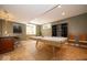 Recreational basement area featuring a pool table, wet bar, and seating, perfect for entertaining guests at 10865 Fairwoods Dr, Fishers, IN 46037