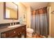 Cozy bathroom featuring a vanity with a granite countertop and a shower with curtain at 10865 Fairwoods Dr, Fishers, IN 46037