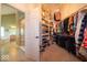 Walk-in closet with custom shelving, built-ins, and ample storage space at 10865 Fairwoods Dr, Fishers, IN 46037