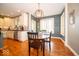 Eat-in kitchen with stainless appliances, granite counters, and stylish light fixture at 10865 Fairwoods Dr, Fishers, IN 46037