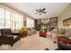 Cozy living room with fireplace, built-in bookshelves, and comfortable seating at 10865 Fairwoods Dr, Fishers, IN 46037