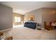 Inviting living room with neutral walls, bright window, comfortable blue sofa, and decorative furnishings for a cozy feel at 10865 Fairwoods Dr, Fishers, IN 46037