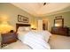 Comfortable main bedroom featuring a tray ceiling, and neutral carpeting at 10865 Fairwoods Dr, Fishers, IN 46037