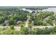 Aerial view of homes surrounded by mature trees, professionally landscaped neighborhood, lake in background at 11266 Old Stone Dr, Indianapolis, IN 46236