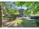 A backyard featuring a combination of brick and blue siding, an outdoor grill and a relaxing hot tub at 11266 Old Stone Dr, Indianapolis, IN 46236