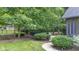 A backyard featuring lush greenery, a hot tub, a barbecue grill, and a serene outdoor setting at 11266 Old Stone Dr, Indianapolis, IN 46236
