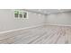 Bright basement featuring durable gray flooring and a well-lit space, perfect for various activities at 11266 Old Stone Dr, Indianapolis, IN 46236