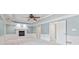 Bedroom with tray ceiling, ceiling fan, and fireplace at 11266 Old Stone Dr, Indianapolis, IN 46236