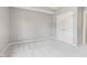 Bedroom with neutral carpet and paint, showcasing a double-door closet at 11266 Old Stone Dr, Indianapolis, IN 46236