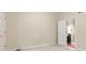 Bedroom with neutral carpet and paint, featuring a closet and a doorway into an adjacent room at 11266 Old Stone Dr, Indianapolis, IN 46236