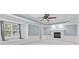 Bedroom with tray ceiling, ceiling fan, and fireplace at 11266 Old Stone Dr, Indianapolis, IN 46236